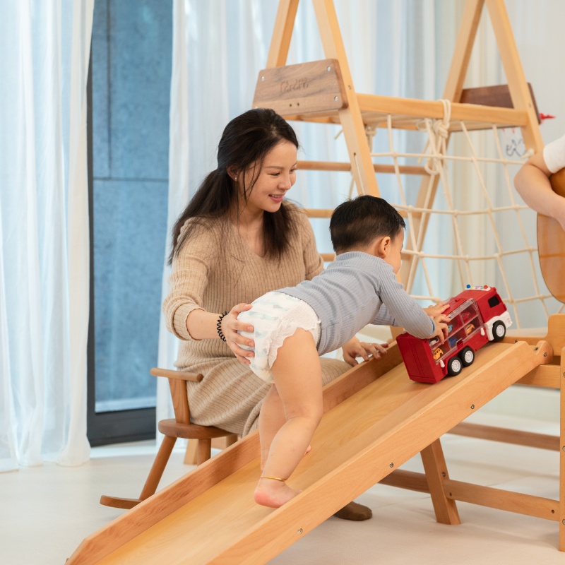 Astra Family A woman and a child enjoying their time on Hoppi New Born Diapers -66 pcs.