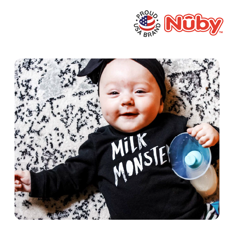 Astra Family A baby wearing a Nuby Comfort Manual Silicone Breast Pump (Milk Collector) monster shirt.