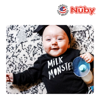 Astra Family A baby wearing a Nuby Comfort Manual Silicone Breast Pump (Milk Collector) monster shirt.