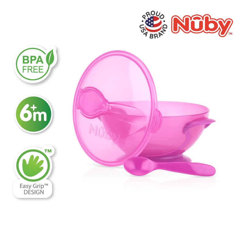 Astra Family A pink bowl with a spoon and utensils.