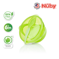 Astra Family A green plastic bowl with a spoon and utensils.