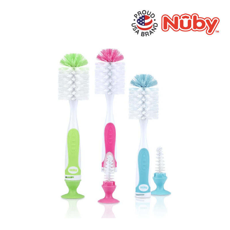 Astra Family Four different colored toothbrushes on a white background.