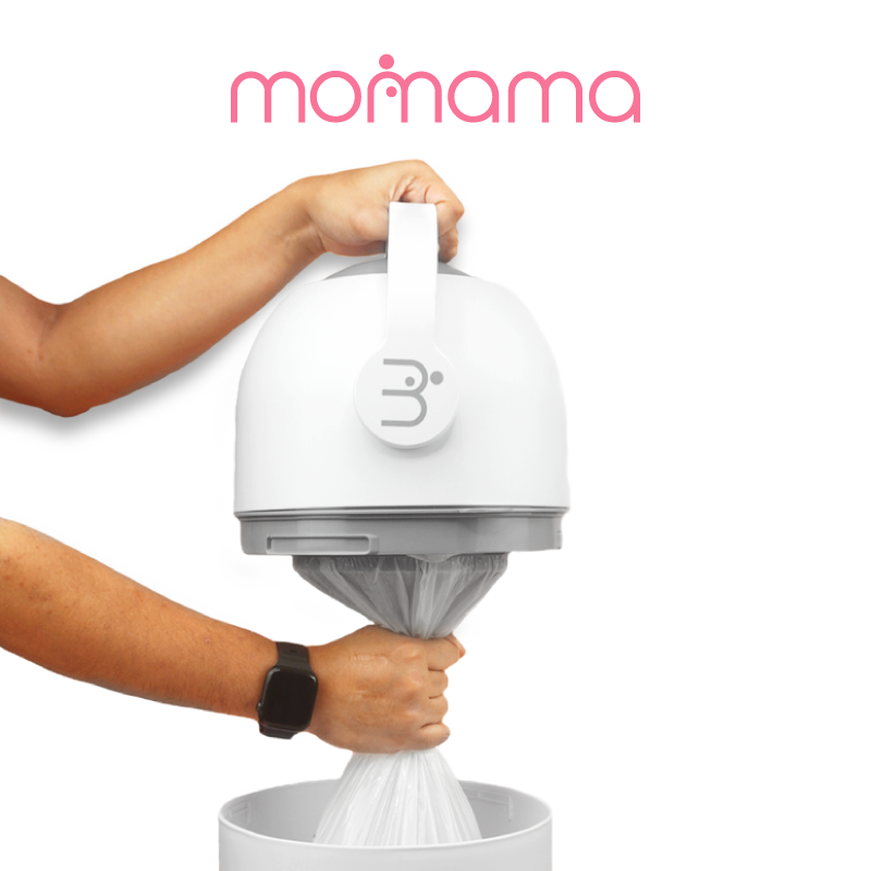 Astra Family A person is holding a white container with the word Momama Odour Free Nappy-Bin on it, which can be used as a no smell trash bin or diapers bin.