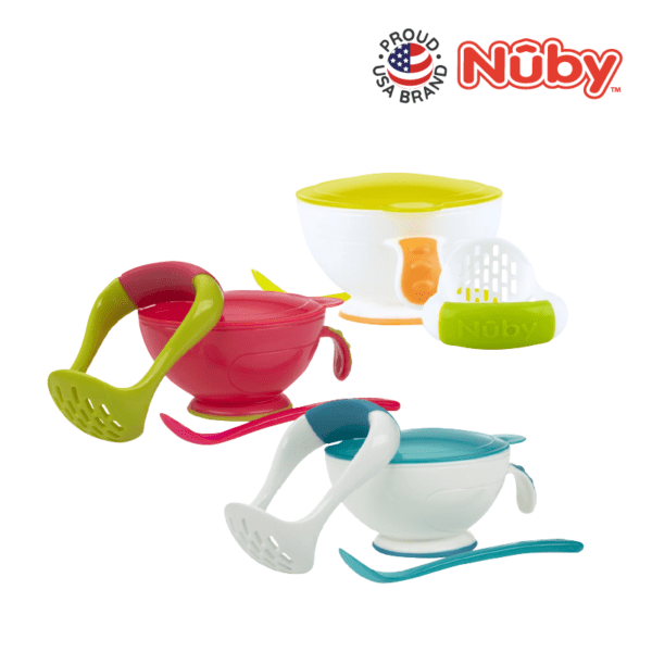 Astra Family A set of colorful bowls with a spoon and utensils.