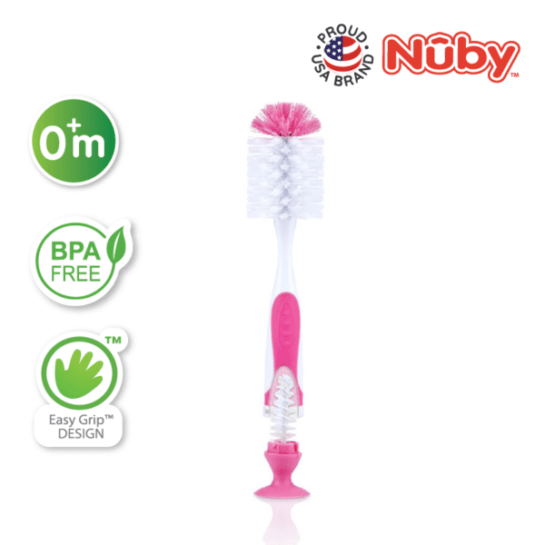 Astra Family A pink and white toothbrush with the words nuby on it.