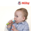 Astra Family A baby is using the Nuby Toothbrush With Bristles (1pc) to brush his teeth.