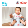 Astra Family A baby is sitting in a Nuby Floor seat - Pink, a comfortable baby spine support chair.