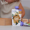 Astra Family A child is enjoying a healthy and organic vegetables puree for babies from Bubs® Organic.