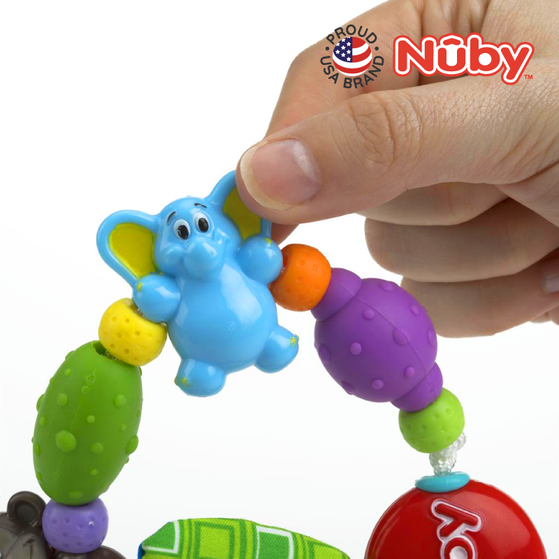 Astra Family A person is holding a Nuby Safari Loop Teether, a safe baby chew toy.