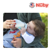 Astra Family A woman feeding a baby with a Nuby Comfort Silicone Bottle With Medium Flow Nipple.