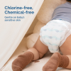 Astra Family A newborn is laying in Hoppi New Born Diapers -66 pcs with the words chlorine-free gentle on baby's sensitive skin.